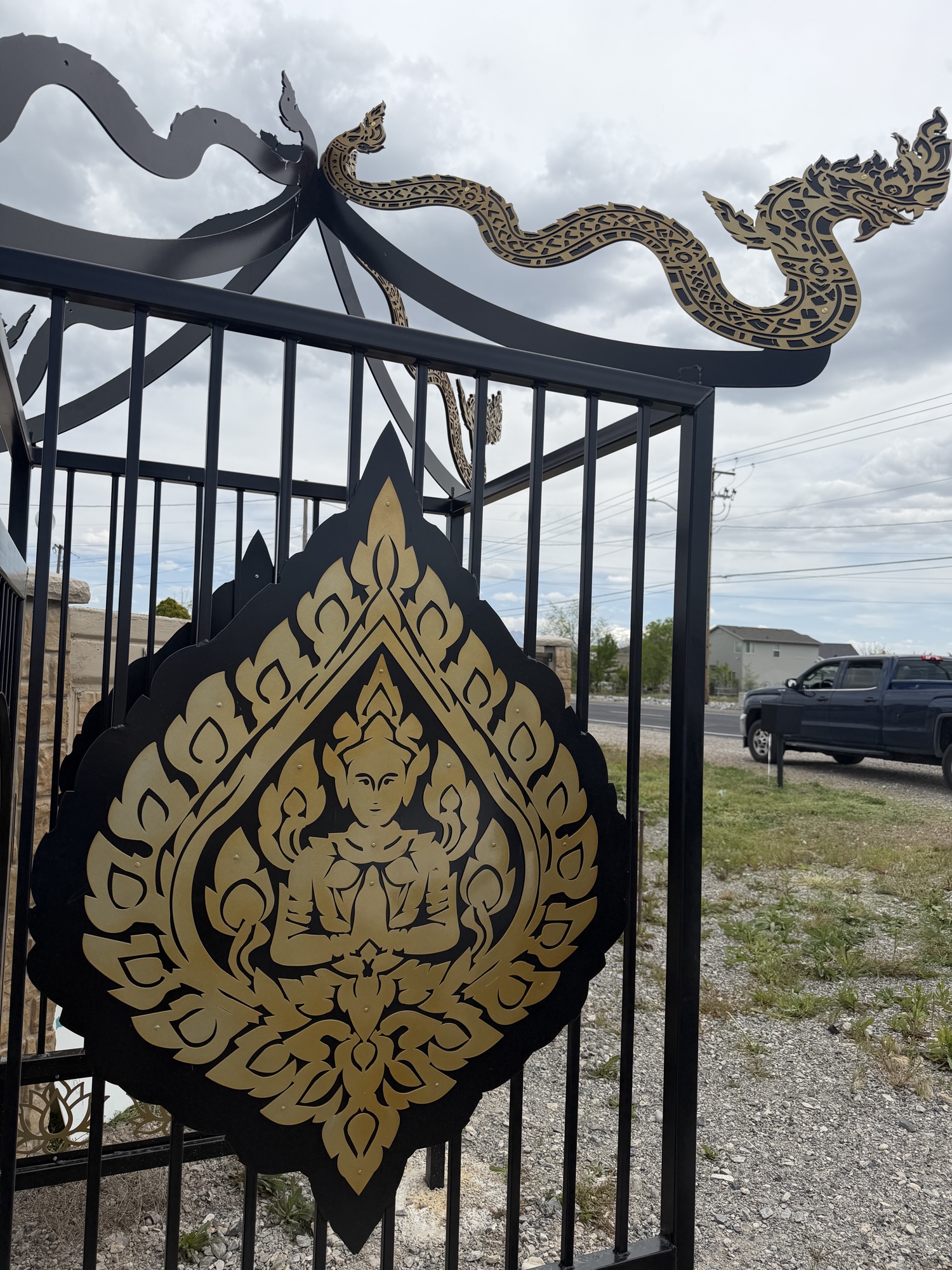 Close-up of dragon gate gold medallion ornamental detail