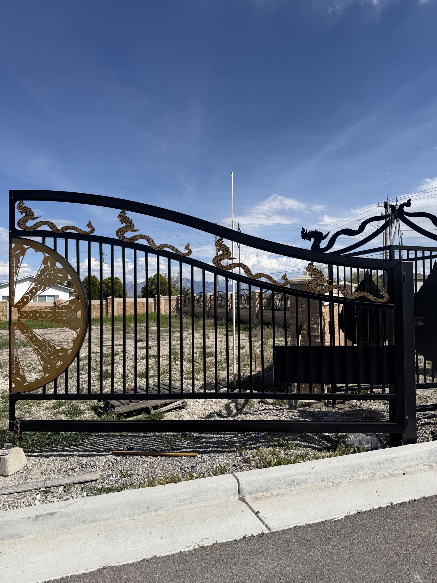 Full ornamental dragon gate against blue sky