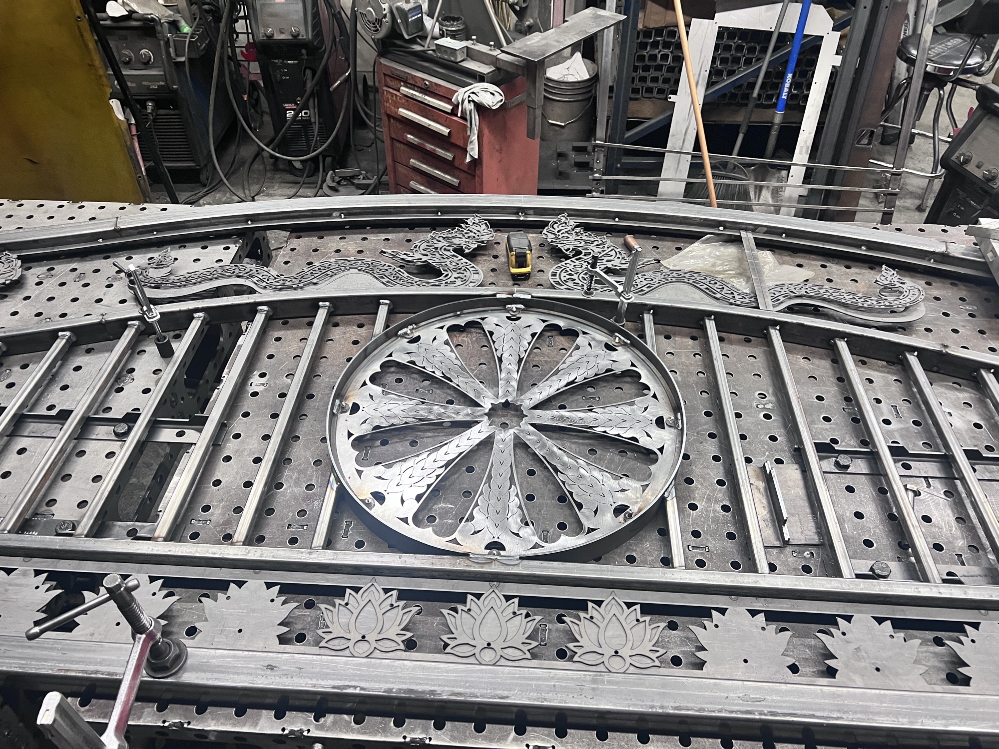 Large ornamental fence panel on welding table