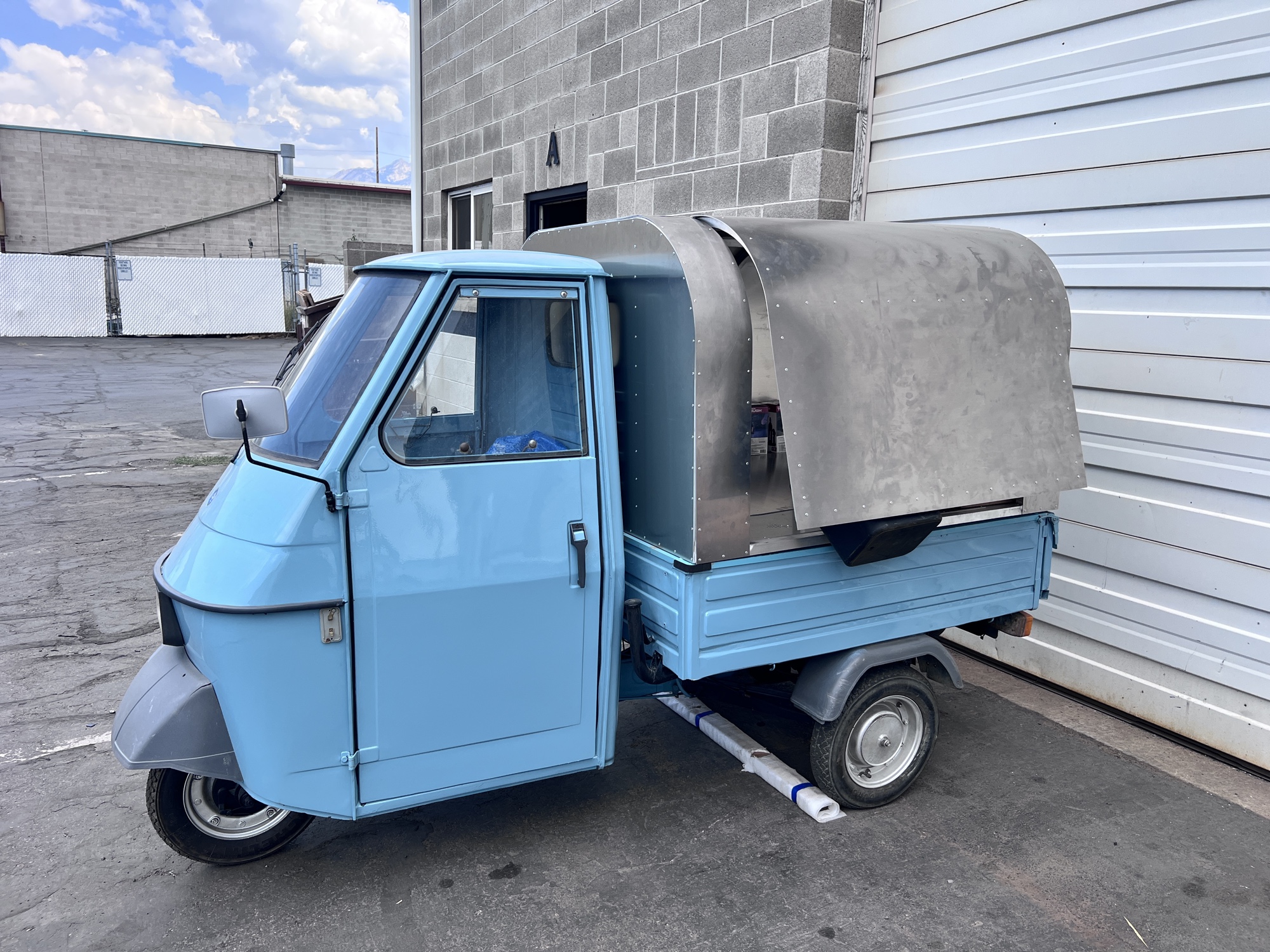 Custom stainless steel canopy fabricated for vintage Piaggio Ape
